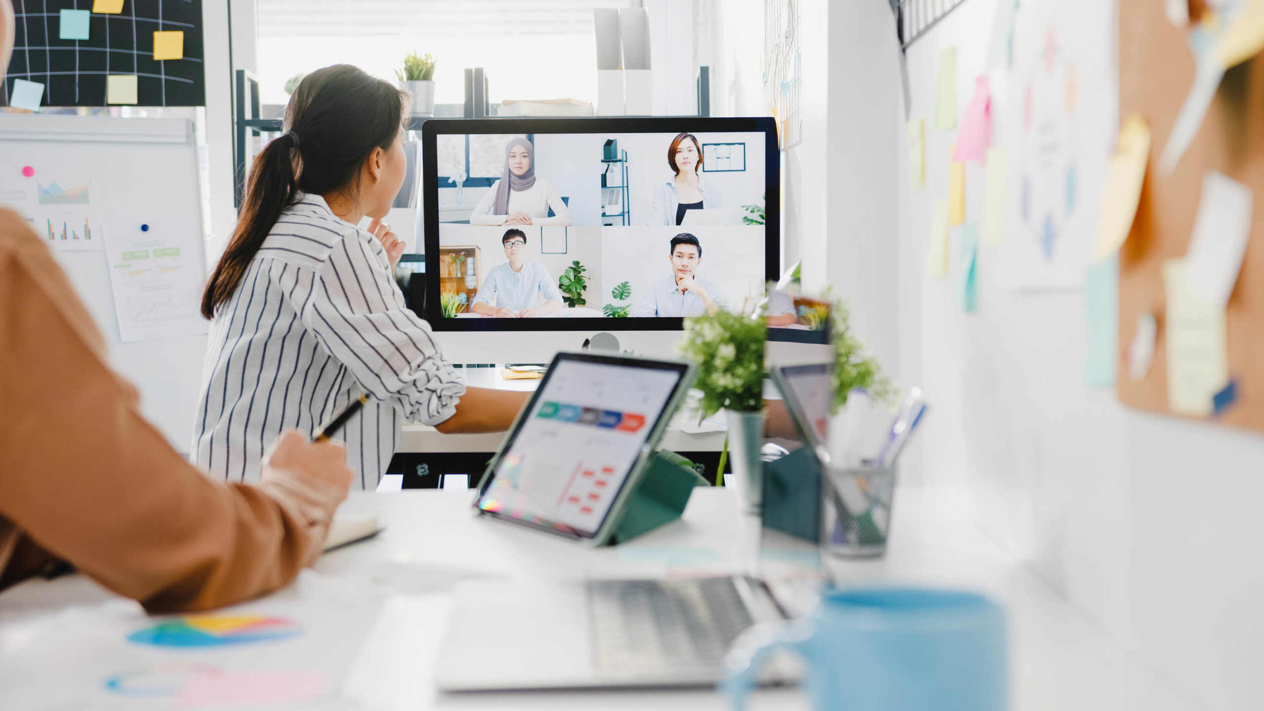 Asia businesspeople using desktop talk to colleagues discussing Work 4.0 and New Work